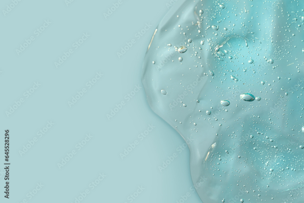 Transparent cleansing gel on light blue background, top view with space for text. Cosmetic product Transparent cleansing gel on light blue background, top view with space for text. Cosmetic product