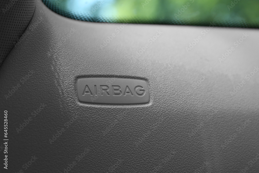 Safety airbag sign on door in car, closeup