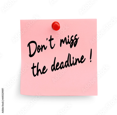 Note with reminder Don't Miss The Deadline attached to white wall