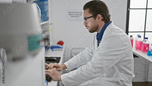 Wallpaper Mural Young hispanic man scientist using computer taking glasses off stressed at laboratory Torontodigital.ca