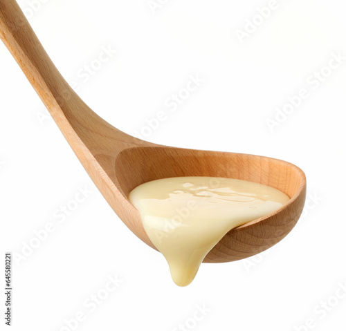 Tableau sur toile condensed milk in wooden ladle
