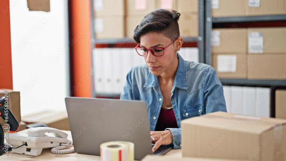 Young beautiful hispanic woman ecommerce business worker taking glasses off stretching arms at office Young beautiful hispanic woman ecommerce business worker taking glasses off stretching arms at office