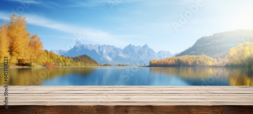 Empty wooden table rustic in front of Beautiful autumn mountain nature lake with blue sky background in the background with copy space  blank for text ads  and graphic design.