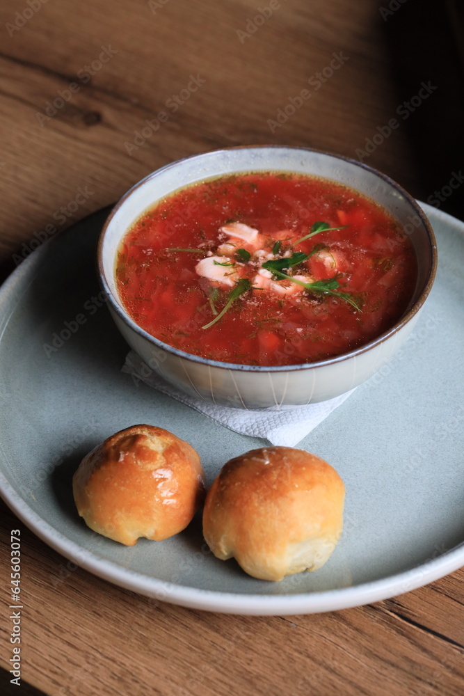 Traditional Ukrainian Russian borscht . Bowl of red beet root soup borsch with white cream . Beet Root delicious soup . Traditional Ukraine food cuisine Traditional Ukrainian Russian borscht . Bowl of red beet root soup borsch with white cream . Beet Root delicious soup . Traditional Ukraine food cuisine