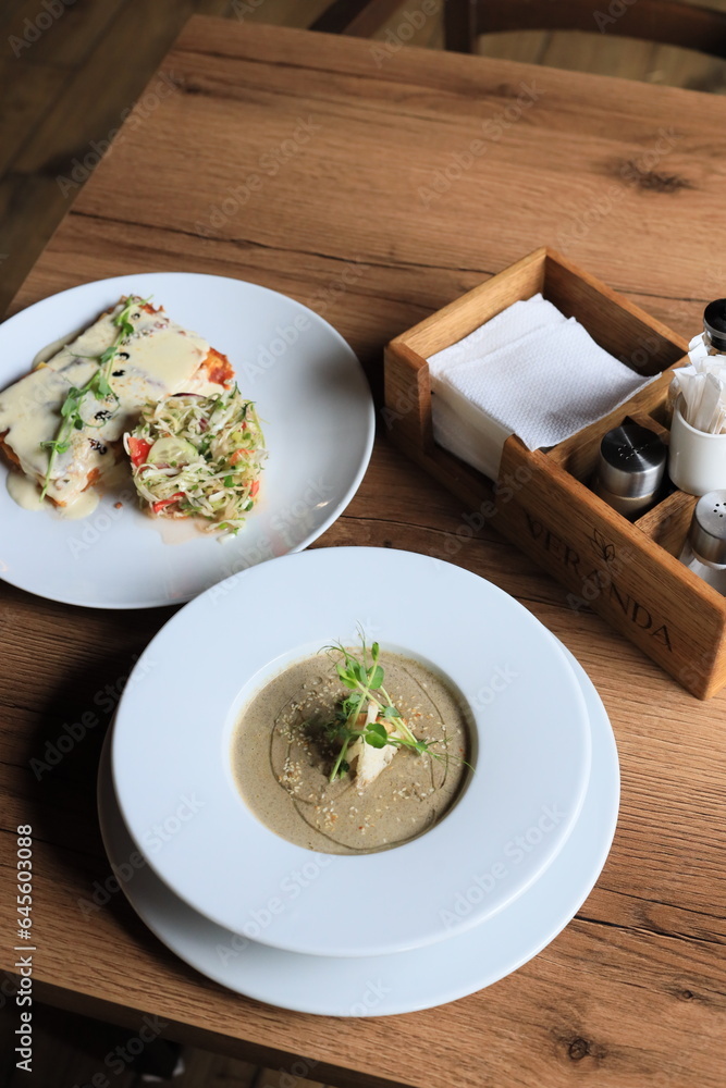 Traditional Ukrainian Russian borscht . Bowl of red beet root soup borsch with white cream . Beet Root delicious soup . Traditional Ukraine food cuisine