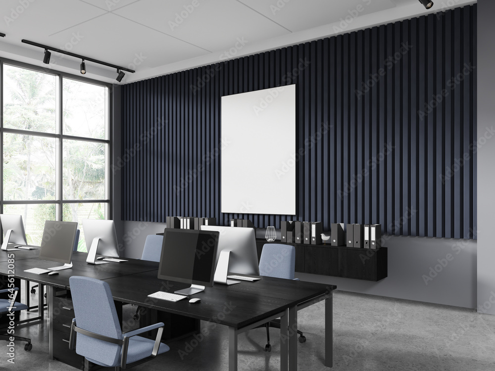 Blue and gray open space office corner with poster Blue and gray open space office corner with poster