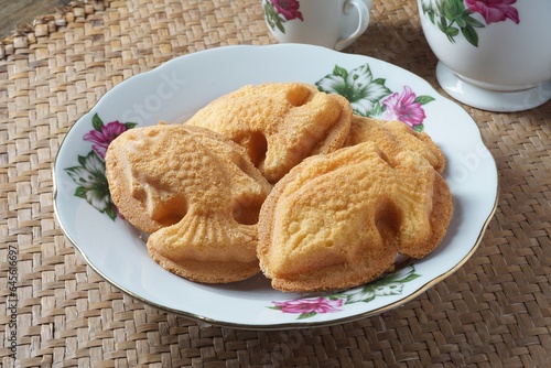 The baulu cake is shaped like a goldfish. Malaysia people called kuih bahulu ikan.