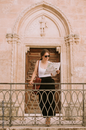Female tourist with city ma...