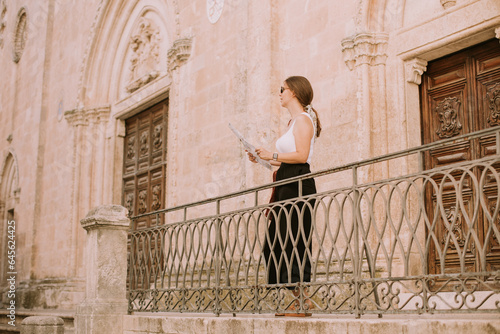 Female tourist with city ma...