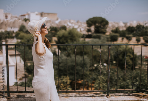 A young woman in a white dr...