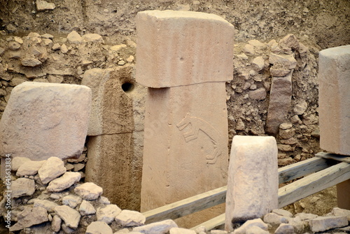 Fototapeta Naklejka Na Ścianę i Meble -  Göbekli Tepe is an archaeological site, located about 18 km northeast of the city of Şanlıurfa in present-day Turkey. A complex of stone buildings dated to the 10th millennium BC was found there.