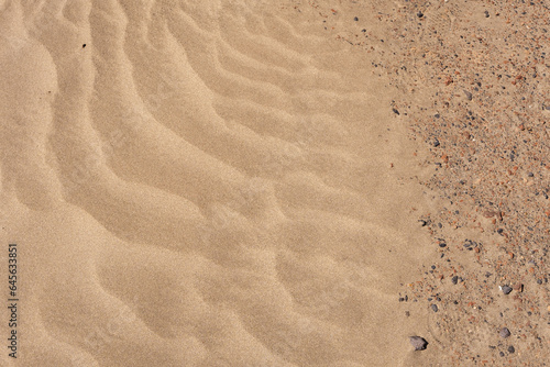 White sand beach. Beach of Famara. Texture of white sand and stones. Caleta de Famara  Lanzarote  Canary Islands  Spain.