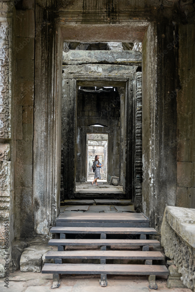 girl through the infinite gates of the Angkor Wat temples girl through the infinite gates of the Angkor Wat temples