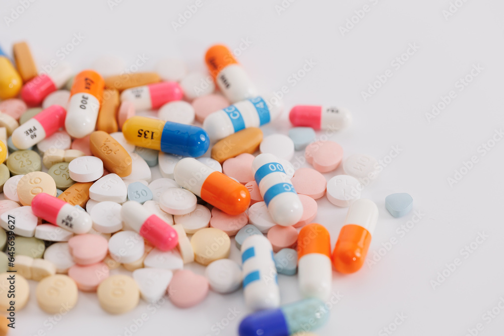 Macro Shot of colour Pills and Capsules During Production and Packing Process on Modern Pharmaceutical Factory. Tablet and Capsule Manufacturing Process. Close-up Shot of Medical Drug Production Line. Macro Shot of colour Pills and Capsules During Production and Packing Process on Modern Pharmaceutical Factory. Tablet and Capsule Manufacturing Process. Close-up Shot of Medical Drug Production Line.