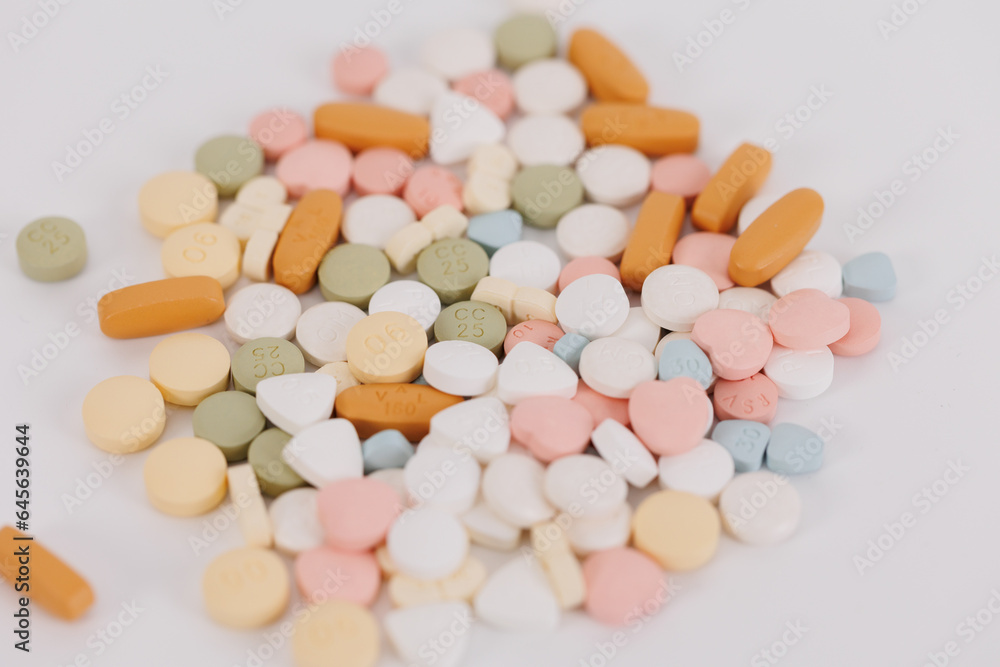 Macro Shot of colour Pills and Capsules During Production and Packing Process on Modern Pharmaceutical Factory. Tablet and Capsule Manufacturing Process. Close-up Shot of Medical Drug Production Line. Macro Shot of colour Pills and Capsules During Production and Packing Process on Modern Pharmaceutical Factory. Tablet and Capsule Manufacturing Process. Close-up Shot of Medical Drug Production Line.