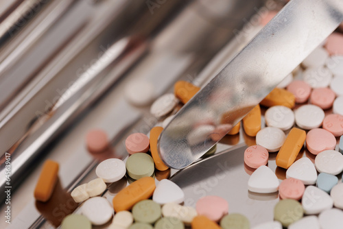 Obraz na płótnie Macro Shot of colour Pills and Capsules During Production and Packing Process on Modern Pharmaceutical Factory. Tablet and Capsule Manufacturing Process. Close-up Shot of Medical Drug Production Line. w salonie