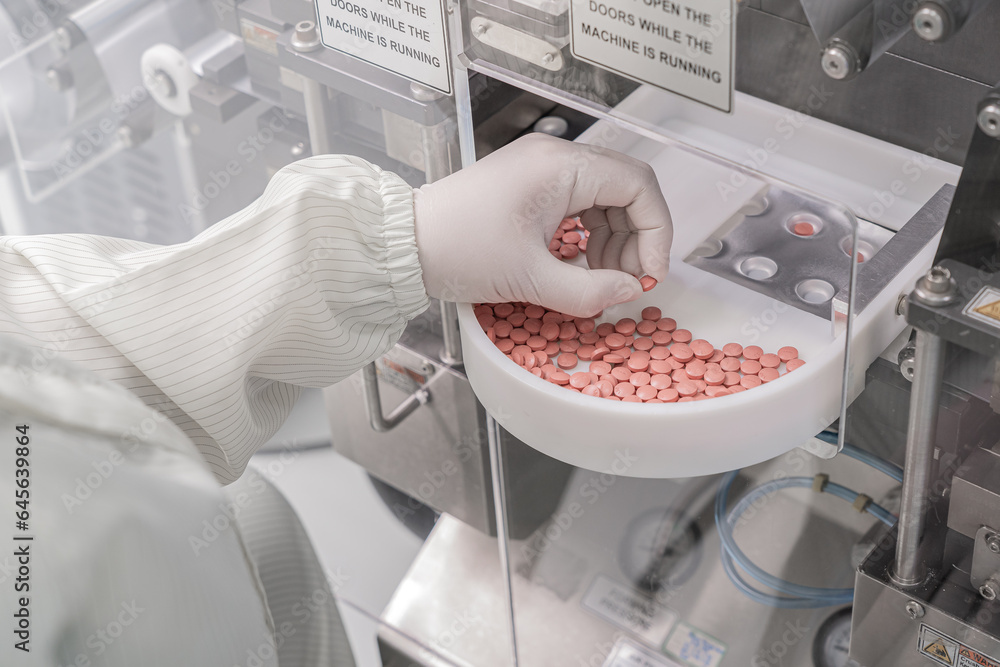 Macro Shot of colour Pills and Capsules During Production and Packing Process on Modern Pharmaceutical Factory. Tablet and Capsule Manufacturing Process. Close-up Shot of Medical Drug Production Line.