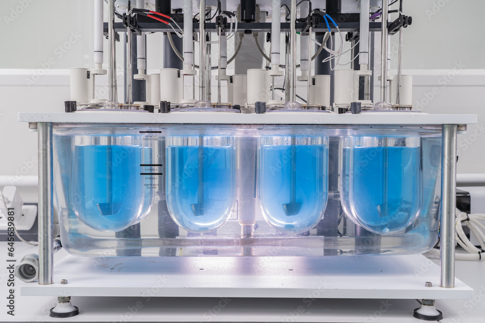Close-up on liquid medicine production and focus on Pills During Enema Production and Packing Process on Modern Pharmaceutical Factory. Concept of Medical Drug Manufacturing Pharma business line.