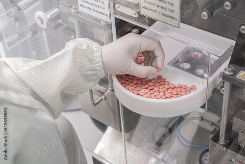 Obraz na płótnie Macro Shot of colour Pills and Capsules During Production and Packing Process on Modern Pharmaceutical Factory. Tablet and Capsule Manufacturing Process. Close-up Shot of Medical Drug Production Line. w salonie