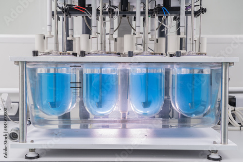 Obraz na płótnie Close-up on liquid medicine production and focus on Pills During Enema Production and Packing Process on Modern Pharmaceutical Factory. Concept of Medical Drug Manufacturing Pharma business line. w salonie