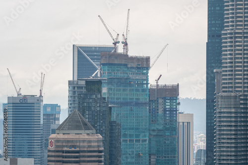 Photography View of сonstruction of new skyscrapers on cloudy day