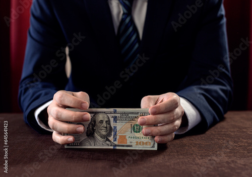 Dollars in the hand of a businessman 6