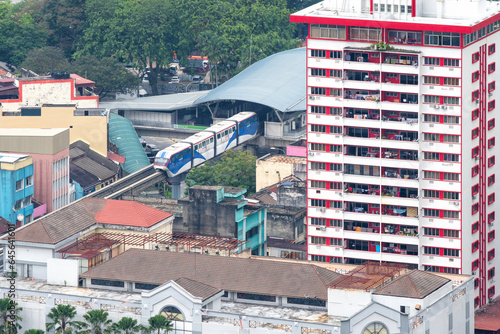 Photography KL Monorail train departing from Chow Kit Monorail Station on cloudy day