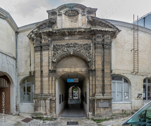 Chalons-en-Champagne, France - 09 01 2023: View of the facade of 17th century portal from the Saint Loup church in passage Henri Vendel. photo