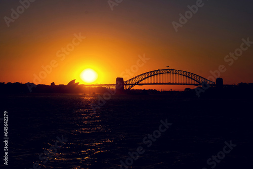 Sunset view of Sydney harbour taken from the Manly Ferry while travelling away from Port Jackson on thr Pacific Ocean