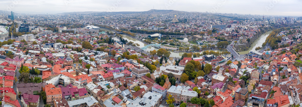 Panoramic aerial view of Tbilisi on cloudy autumn day. Georgia.