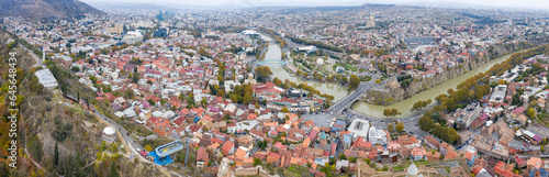 Panoramic aerial view of Tbilisi and Kura river on cloudy autumn day. Georgia.