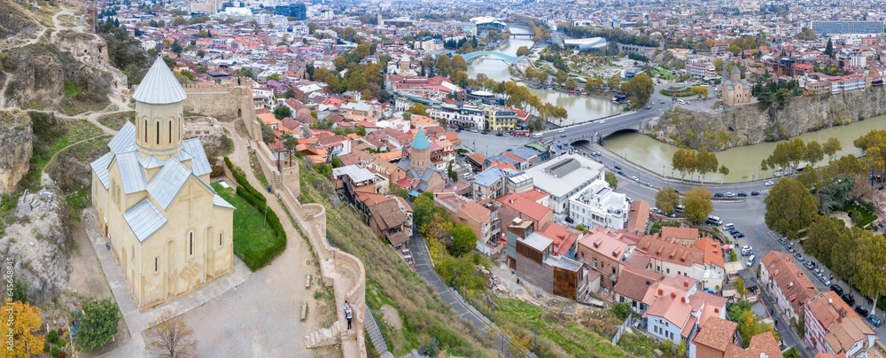 Aerial view of Saint Nicholas's Church, Narikala Fortress and Old Town on cloudy day. Tbilisi, Georgia.