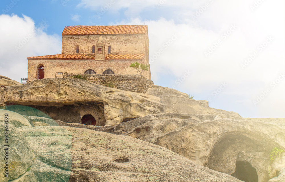 Old stone walls of the Orthodox Church and cave of Uplestsikhe in Georgia