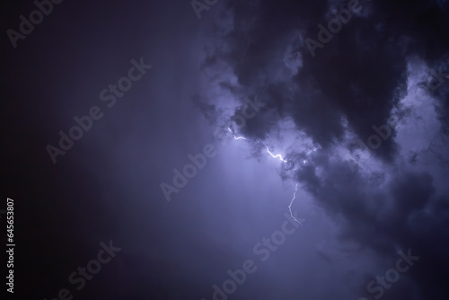 Ray. Storm. The sky is full of dark clouds in bad weather before a big storm rain. Light emission from the Edge of clouds. Zoom the surface of a Black haze at close range.