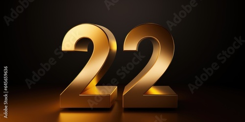A 3D, shiny gold number 22 on a dark background. photo