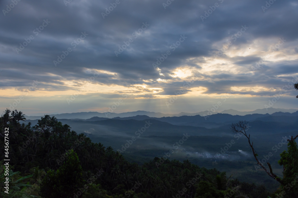 Fog and clouds at dawn over the tropical forest