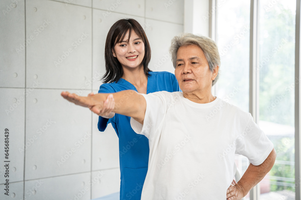 Beautiful asian nurse taking care of senior woman to exercise at hospital. She feeling happy when take care senior woman. Healthcare, Retirement, Volunteer, Caregiver and Lifestyle concept. Beautiful asian nurse taking care of senior woman to exercise at hospital. She feeling happy when take care senior woman. Healthcare, Retirement, Volunteer, Caregiver and Lifestyle concept.