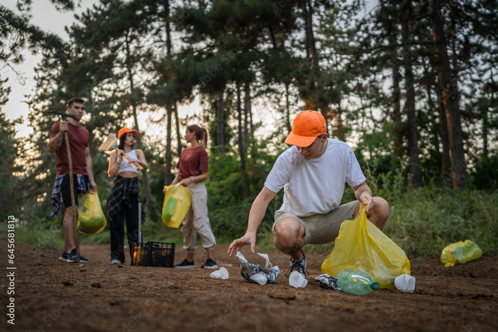 teenage friends young men women pick up waste garbage to clean forest teenage friends young men women pick up waste garbage to clean forest