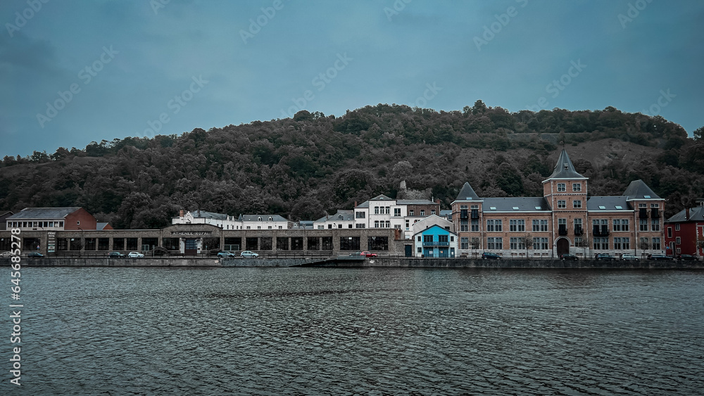 The view of Dinant from Meuse river in Belgium in summer The view of Dinant from Meuse river in Belgium in summer