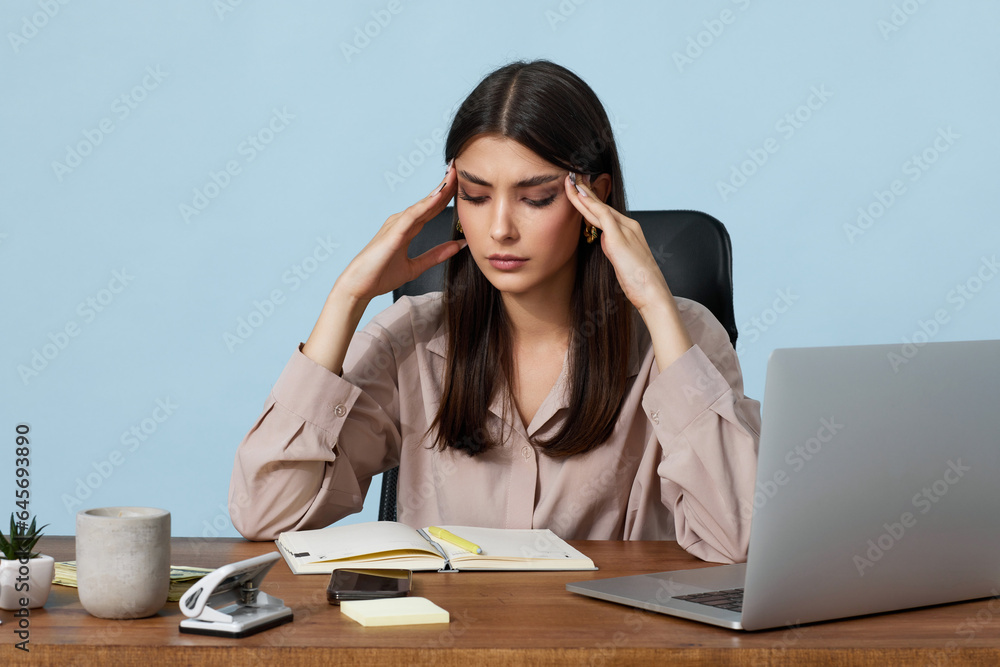 sad woman have a headache, using laptop sad woman have a headache, using laptop
