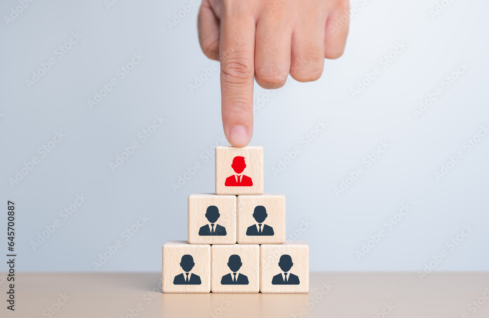HR or Manager hand choosing man people icons on wooden cube blocks. Employee lead choice. Career opportunity, Good worker. Human Resource Management concept. Business hiring and recruitment selection. HR or Manager hand choosing man people icons on wooden cube blocks. Employee lead choice. Career opportunity, Good worker. Human Resource Management concept. Business hiring and recruitment selection.