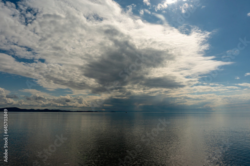 Densely cloudy weather, reflection of the clouds on the sea.