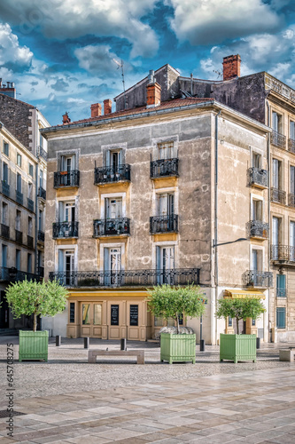 Old stone building representative of the architecture of the city of Beziers, built during the 19th century. The city is situated in the Languedoc region of France