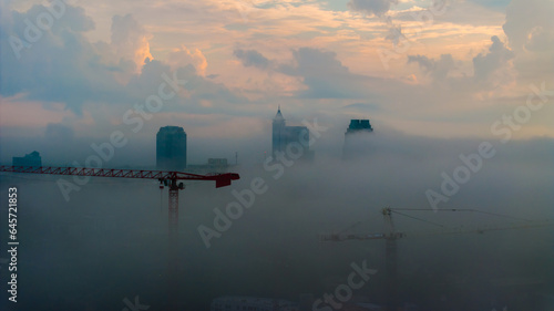 Foggy Morning in Raleigh with Construction Crane and Skyline - Aerial View