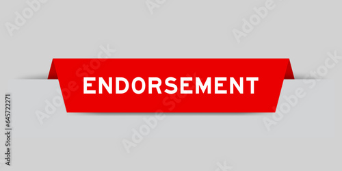 Red color inserted label with word endorsement on gray background