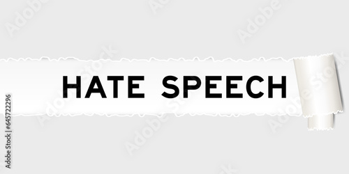 Ripped gray paper background that have word hate speech under torn part