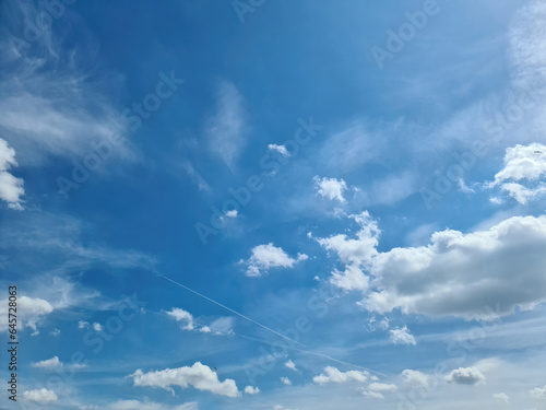 Beautiful fluffy white cloud formations in a deep blue summer sky