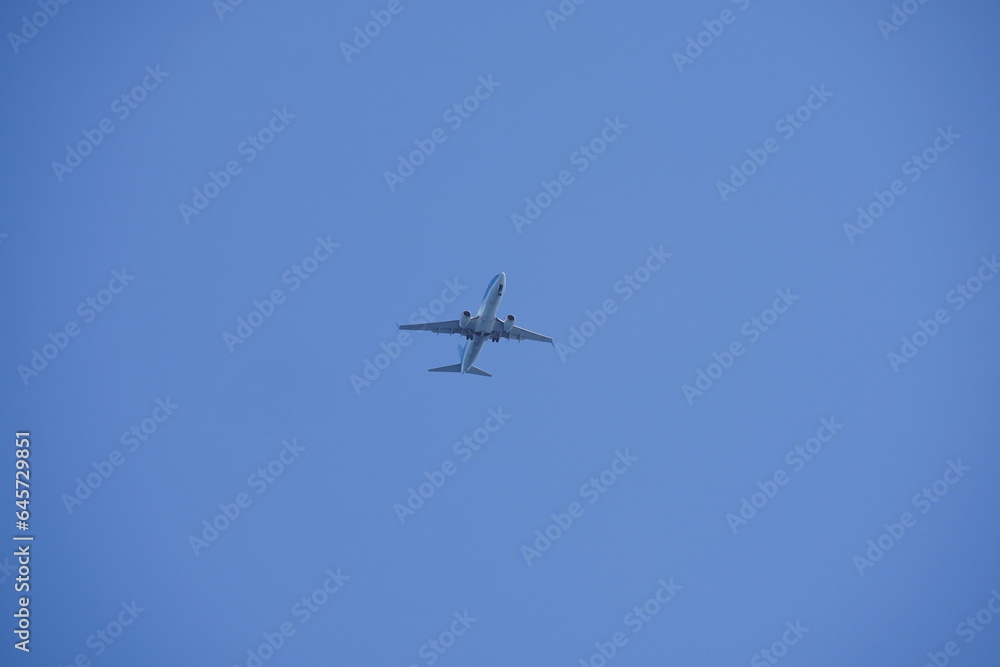 Shot of a jet plane high in the blue skies. Shot of a jet plane high in the blue skies.