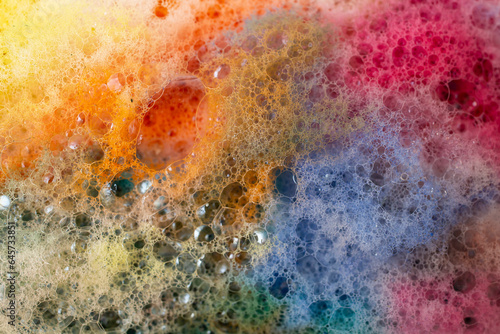 Multicolored foam rainbow bubbles, abstract soft focus close up