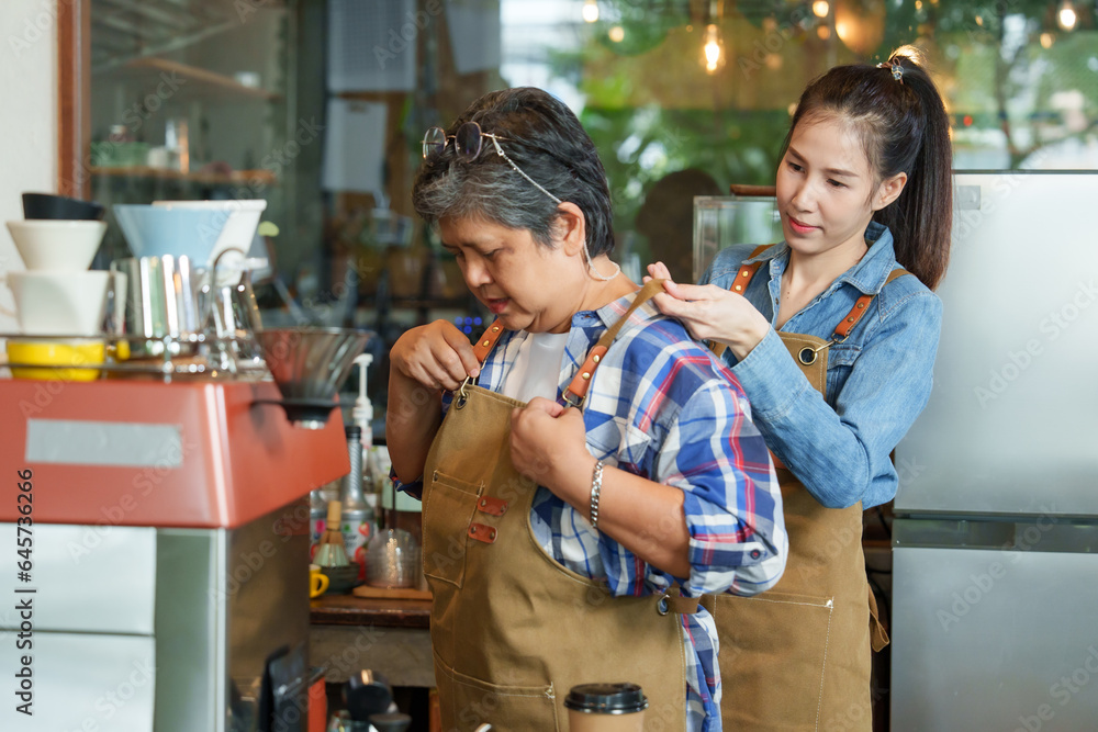 Retired single mom with small businessman Asian daughter. taking care of mother who is making coffee taking orders from customers. The cafe is family business. There are both bakery and bread. Retired single mom with small businessman Asian daughter. taking care of mother who is making coffee taking orders from customers. The cafe is family business. There are both bakery and bread.